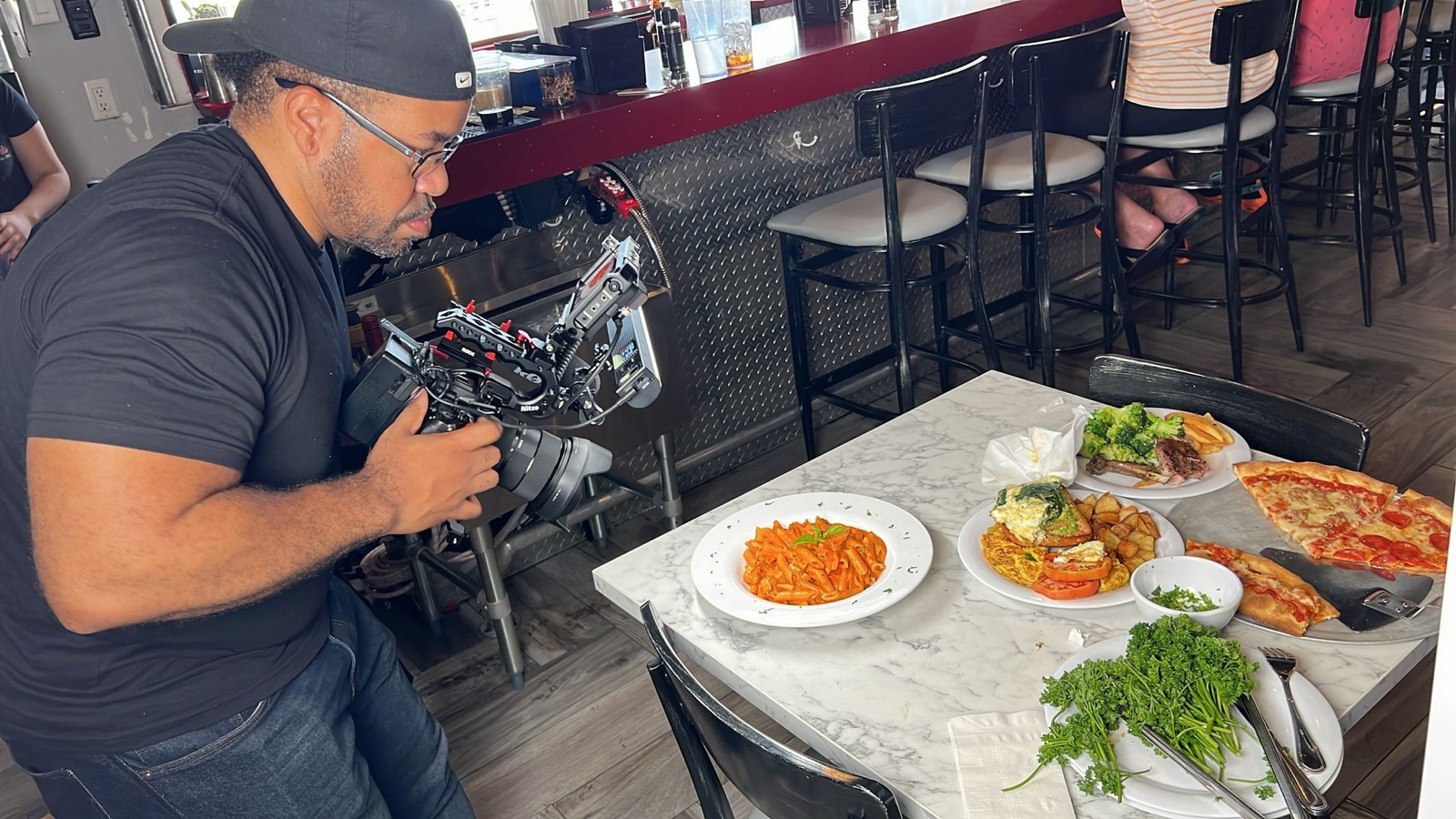 Operating a camera rig on location at a ThatsKrispy shoot